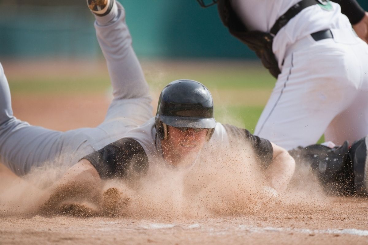 Baseball Player Sliding Into Home Plate