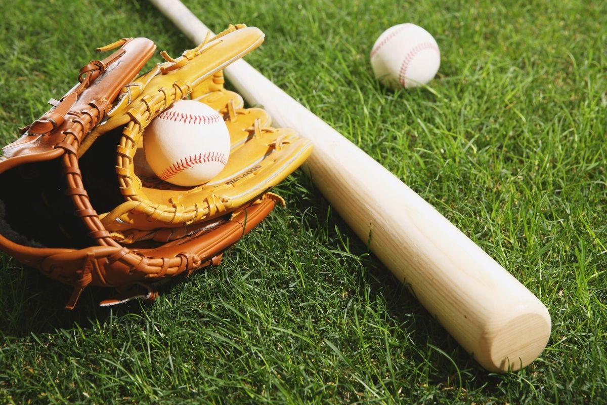 Baseball Equipment on Grass Field
